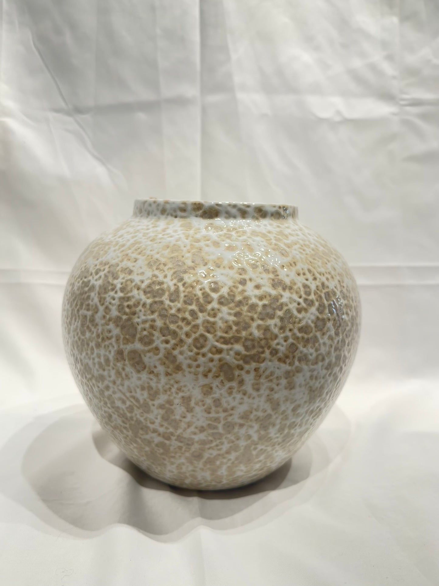 White and tan speckled vase