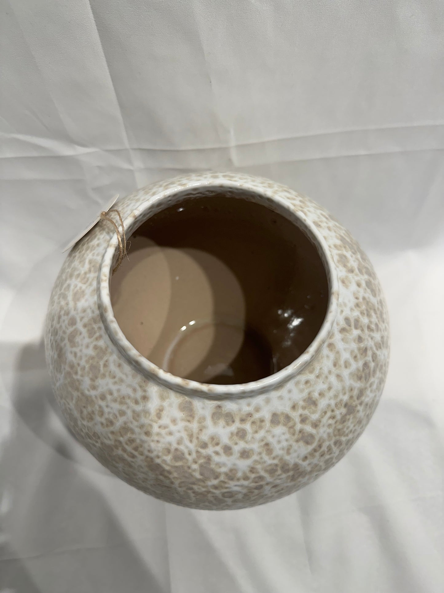 White and tan speckled vase