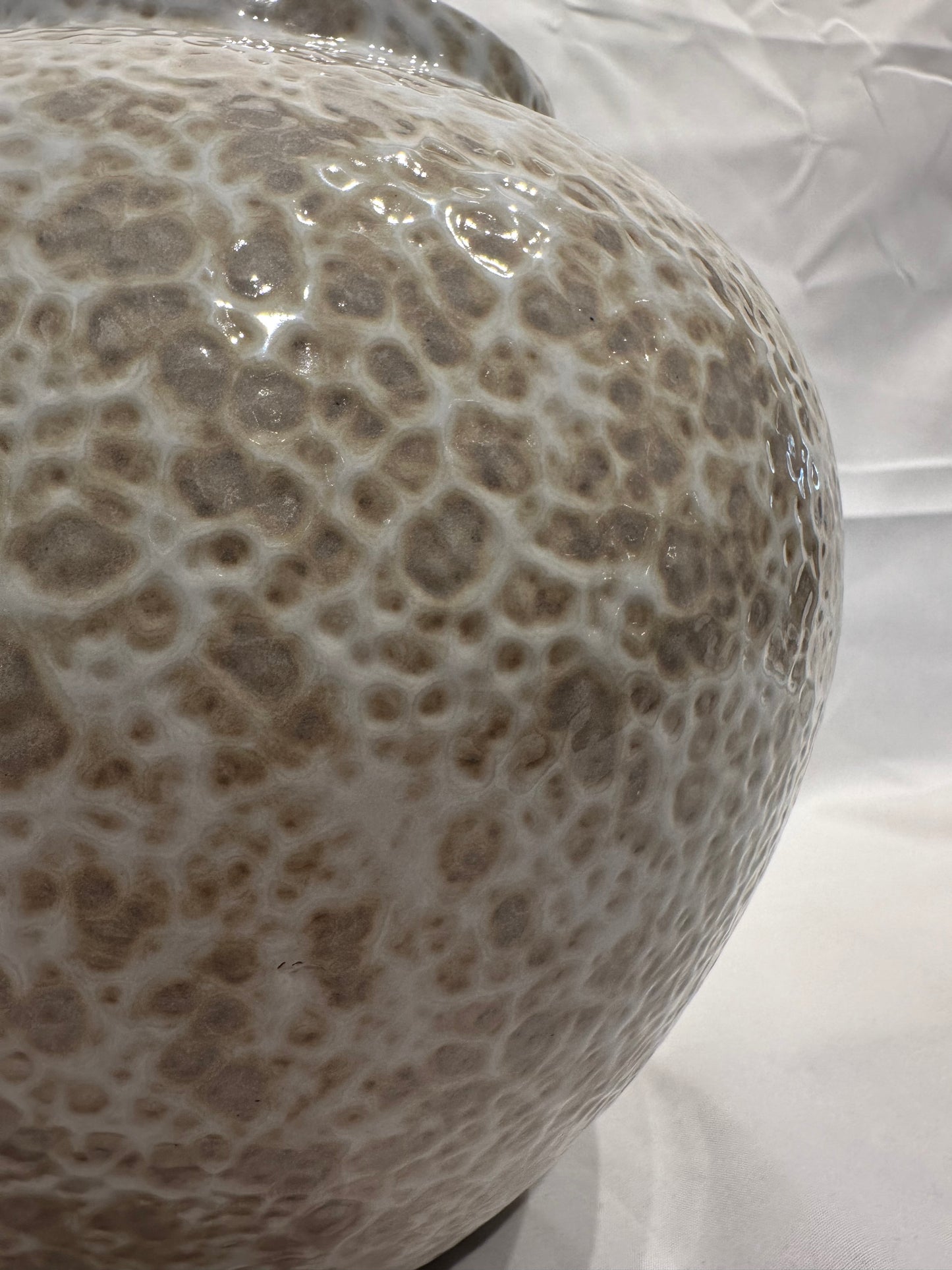 White and tan speckled vase