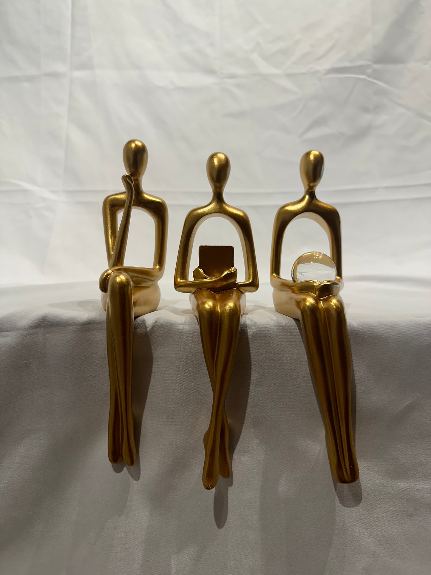 Gold women figurines