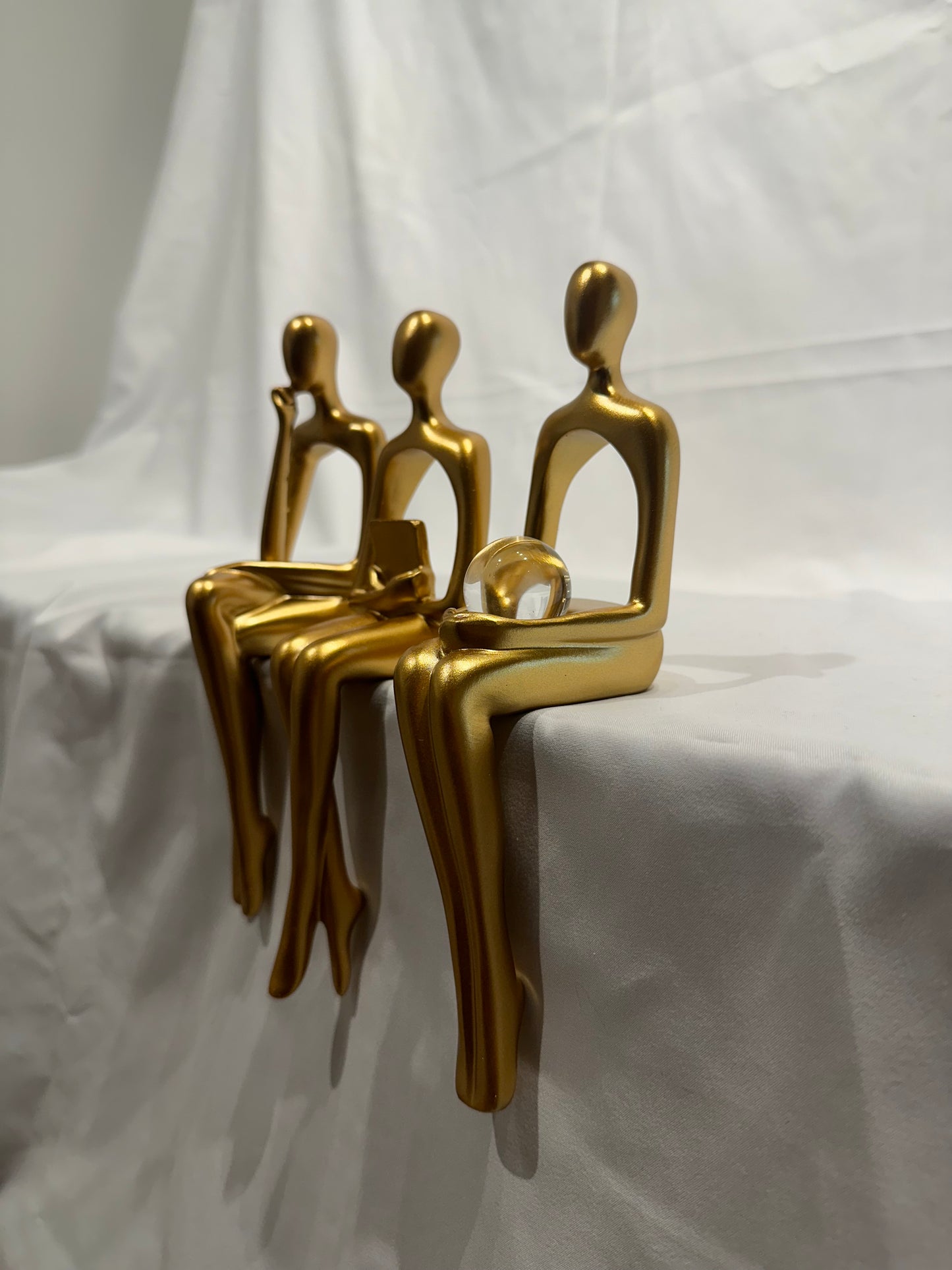 Gold women figurines