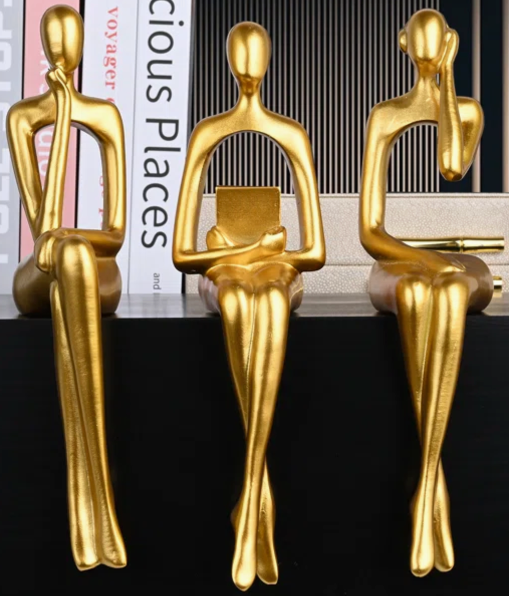 Gold women figurines